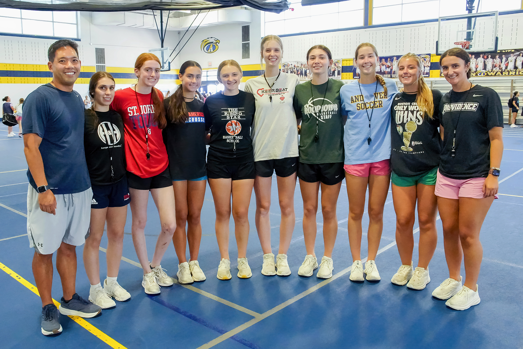 AHS Girls Basketball players and their coach at Hooptown camp.
